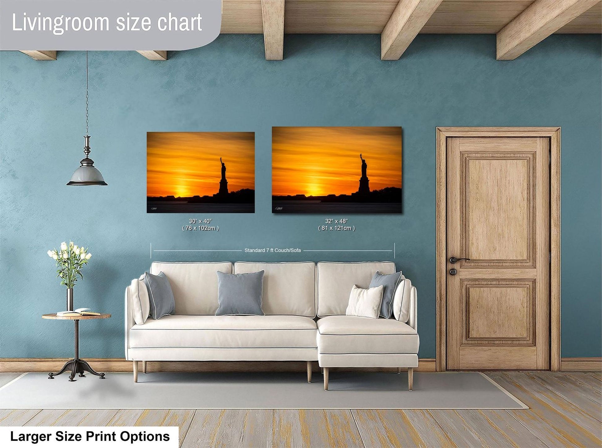 a living room with a white sofa, a wooden door, and a painting of the Statue of Liberty on the wall.