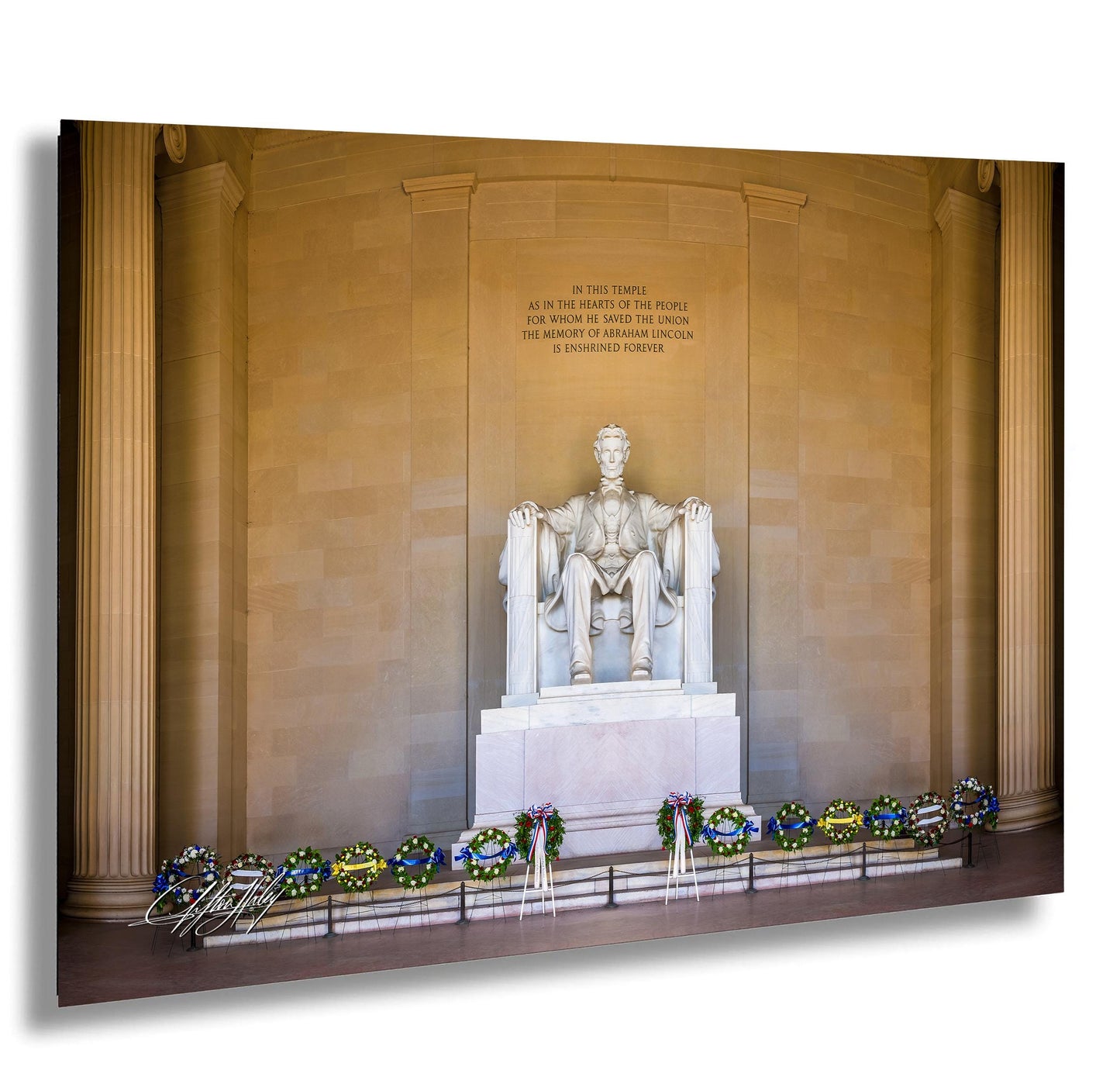 This fine art photograph captures the Lincoln Memorial in Washington DC during the quiet beauty of sunrise. The iconic marble statue of Abraham Lincoln sits beneath the powerful inscription honoring the president who preserved the Union. With soft morning light illuminating the historic monument and ceremonial wreaths placed along the base, this image celebrates one of America’s most meaningful landmarks. Perfect for collectors of Washington DC photography, presidential history artwork