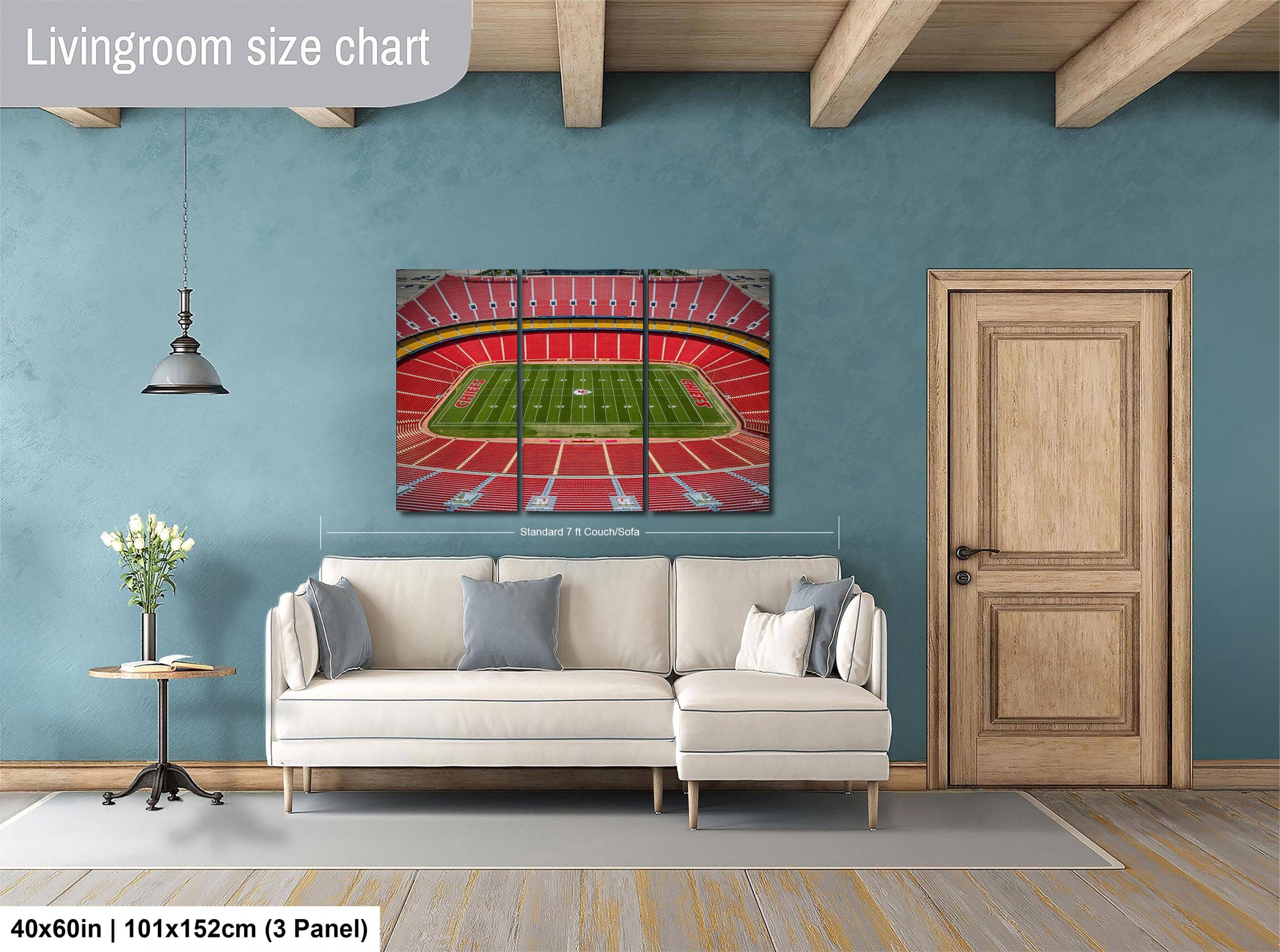a living room with a white sofa, a wooden door, and a large wall art depicting a football stadium.