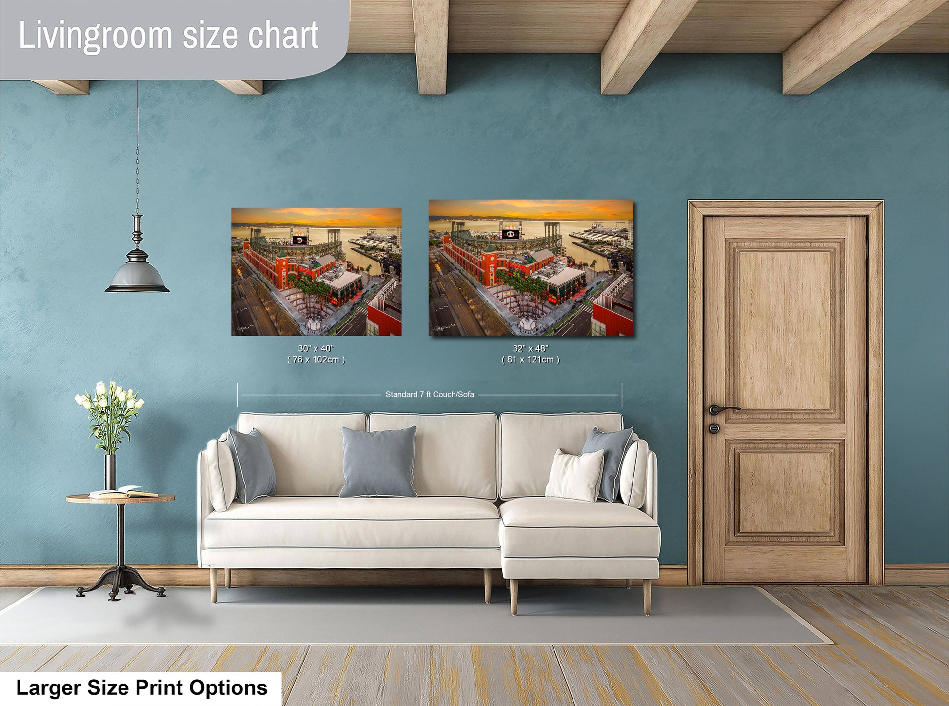 a living room with a white sofa, a wooden door, and a painting of a cityscape on the wall.