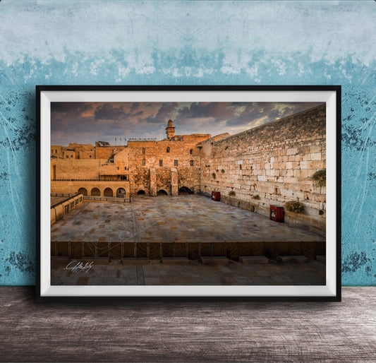 a large stone wall with arches, set against a cloudy sky.