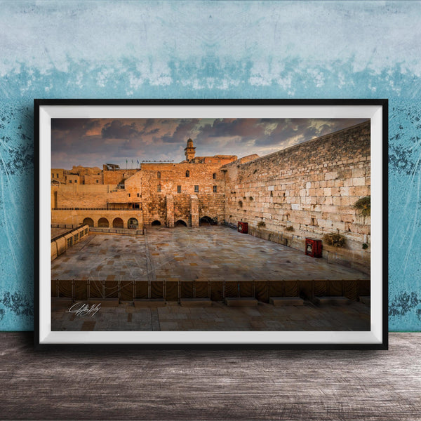 a large stone wall with arches, set against a cloudy sky.