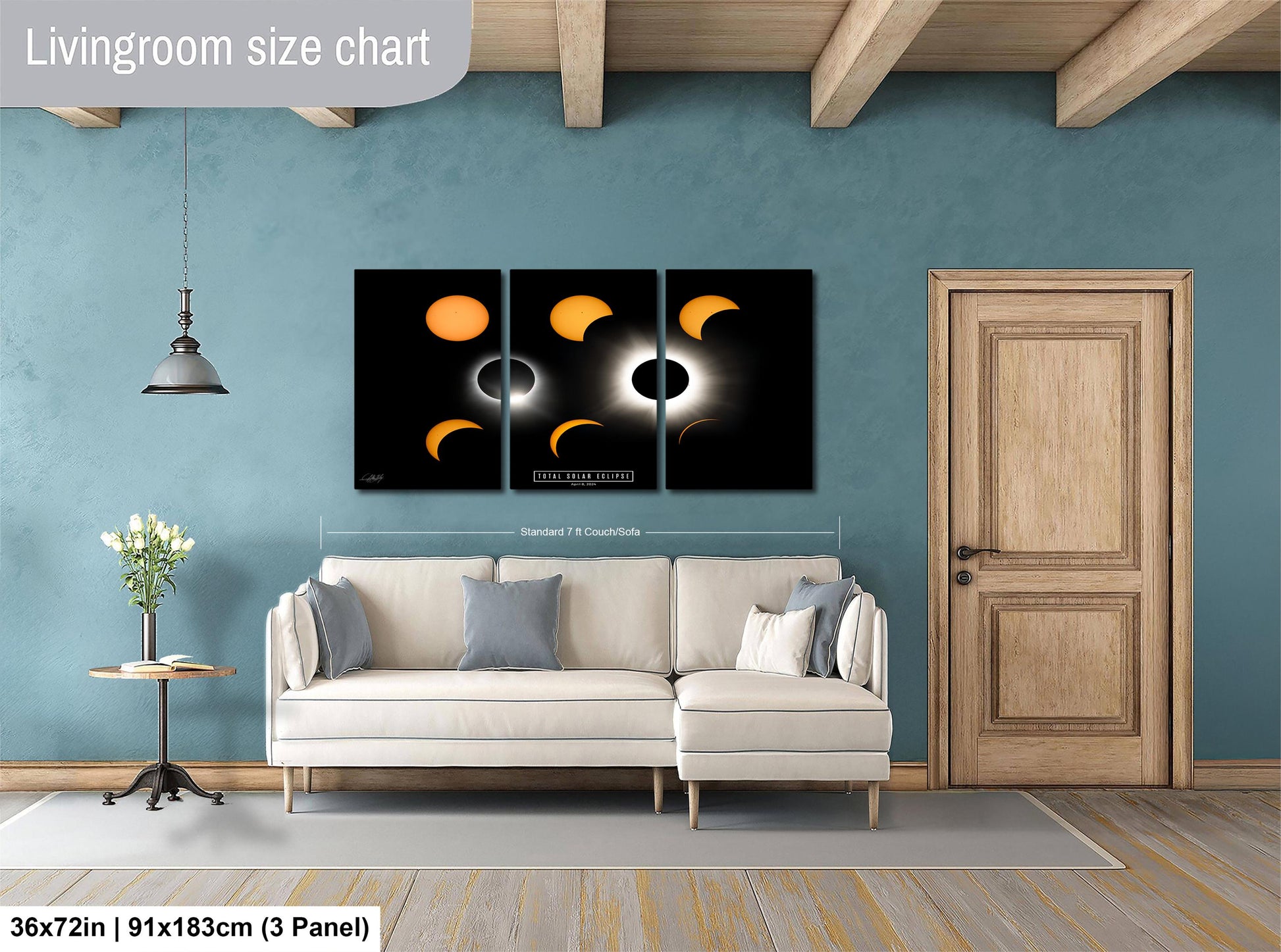 The image is a living room with a white sofa, a wooden door, and a large wall art depicting the phases of the moon.