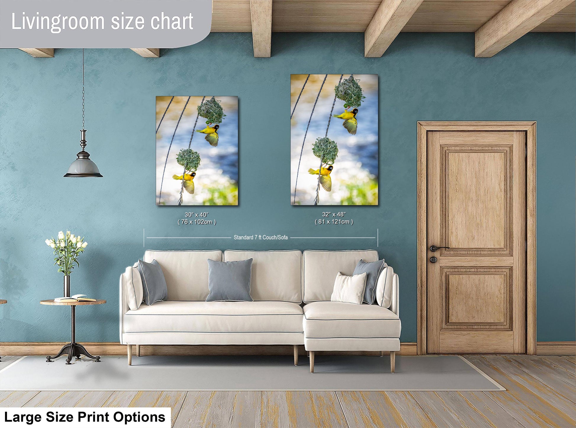 a living room with a white sofa, a wooden door, and a painting of a bird hanging from a wire on the wall.