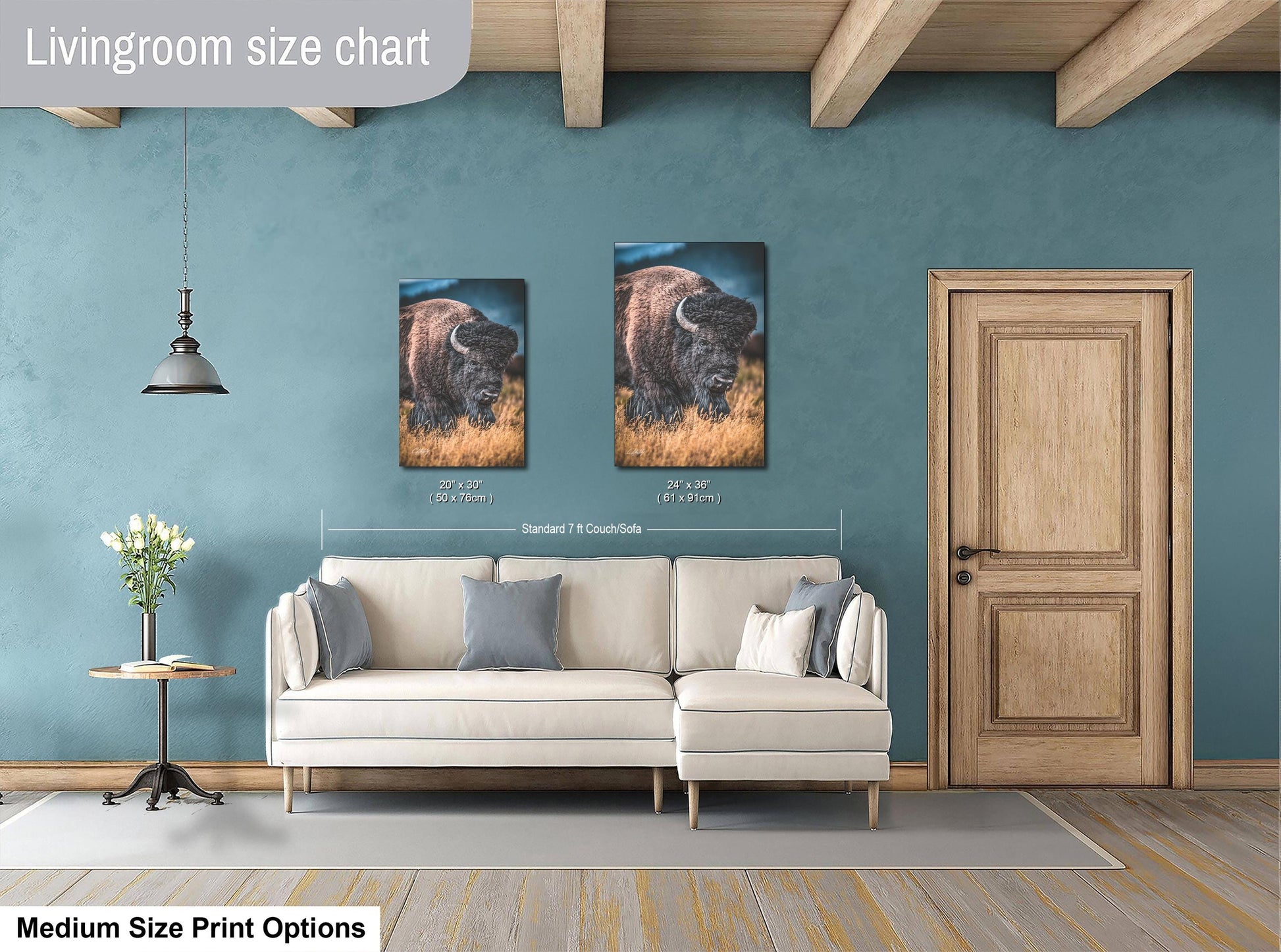 a living room with a white sofa, a wooden door, and a painting of a bison on the wall. The living room appears to be designed for relaxation and comfort, with a focus on the artwork and the overall aesthetic.