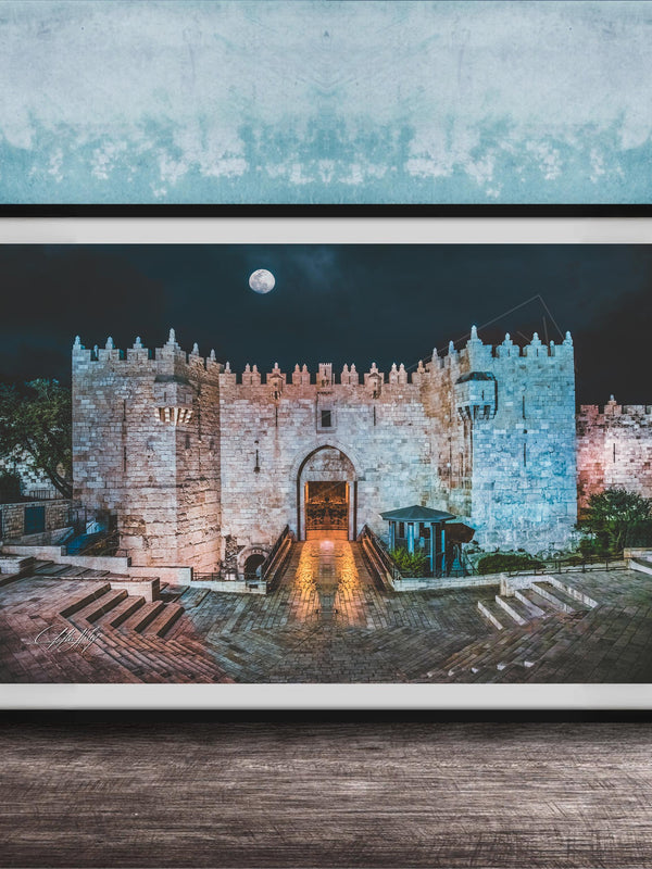 a castle with a moonlit night scene, featuring a large archway leading to a tower.