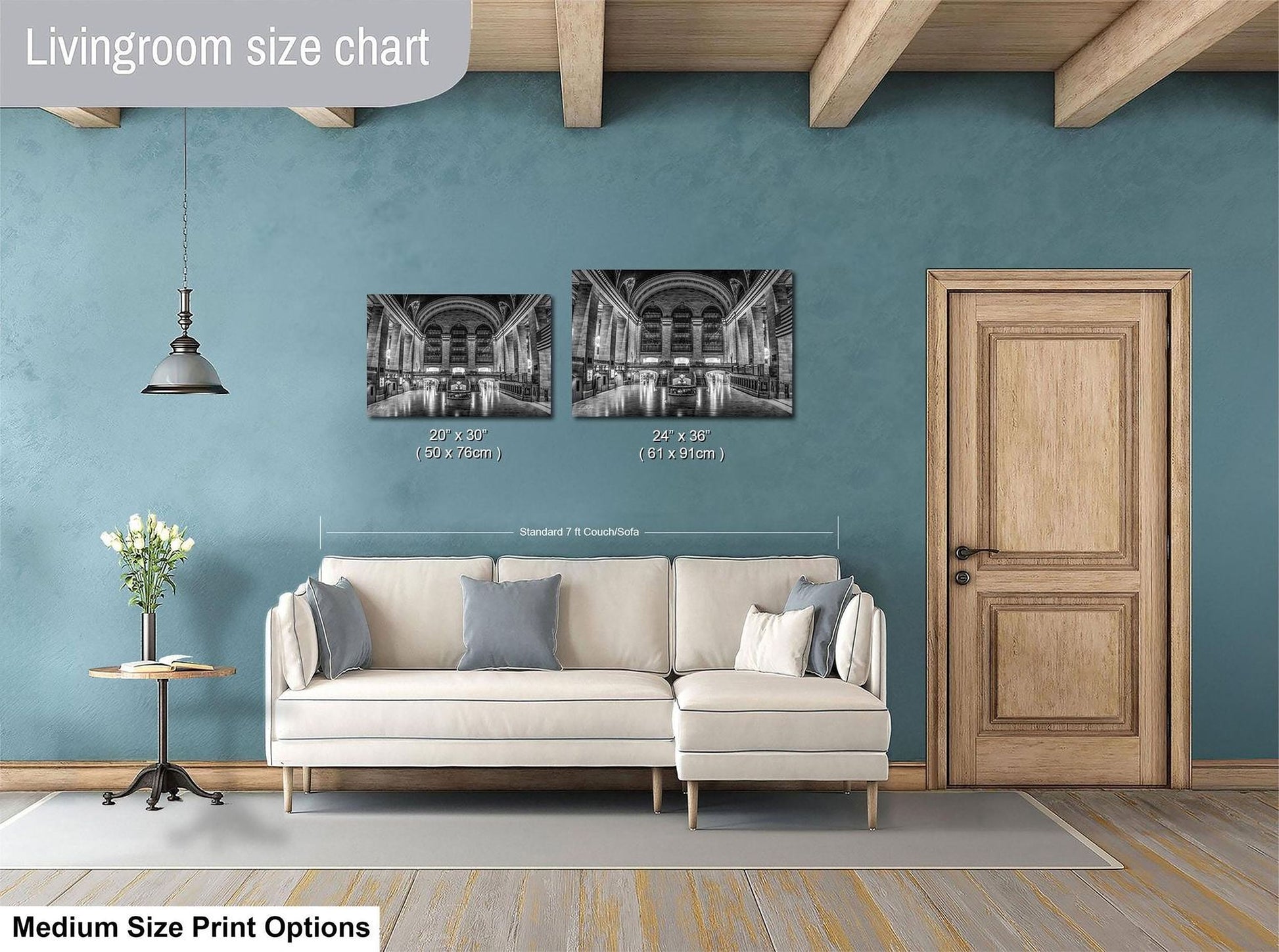 a living room with a white sofa, a wooden door, and a hanging light fixture. Above the sofa, there is a size chart indicating the dimensions of the artwork displayed on the wall.