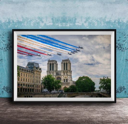 A framed photograph of the French Air Force performing a military air show, with fighter jets flying in formation and leaving trails of smoke in the sky. The backdrop is the iconic Notre-Dame Cathedral in Paris.