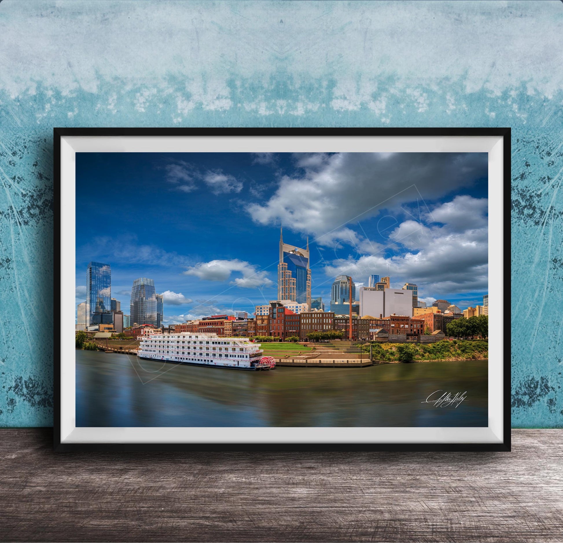 A framed photograph of the Nashville skyline, featuring the iconic skyline of Nashville, Tennessee, with the city's iconic landmarks such as the Tennessee State Capitol and the Nashville River.
