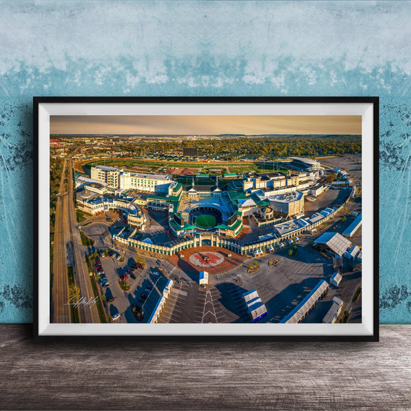 An aerial view of a large, multi-purpose complex with various buildings, roads, and parking areas.
