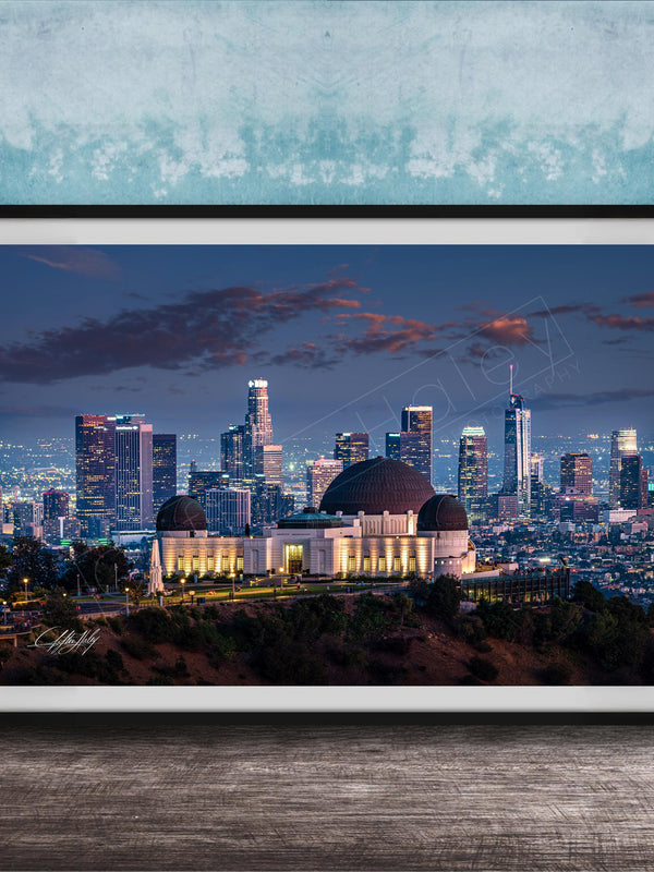 A framed photograph of the Los Angeles skyline at night, with the Griffith Observatory prominently featured in the foreground.