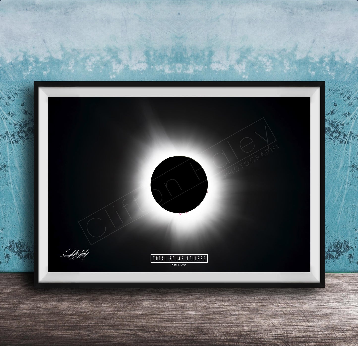 The image is a framed poster depicting a total solar eclipse, with a black background and a bright white solar disk in the center.