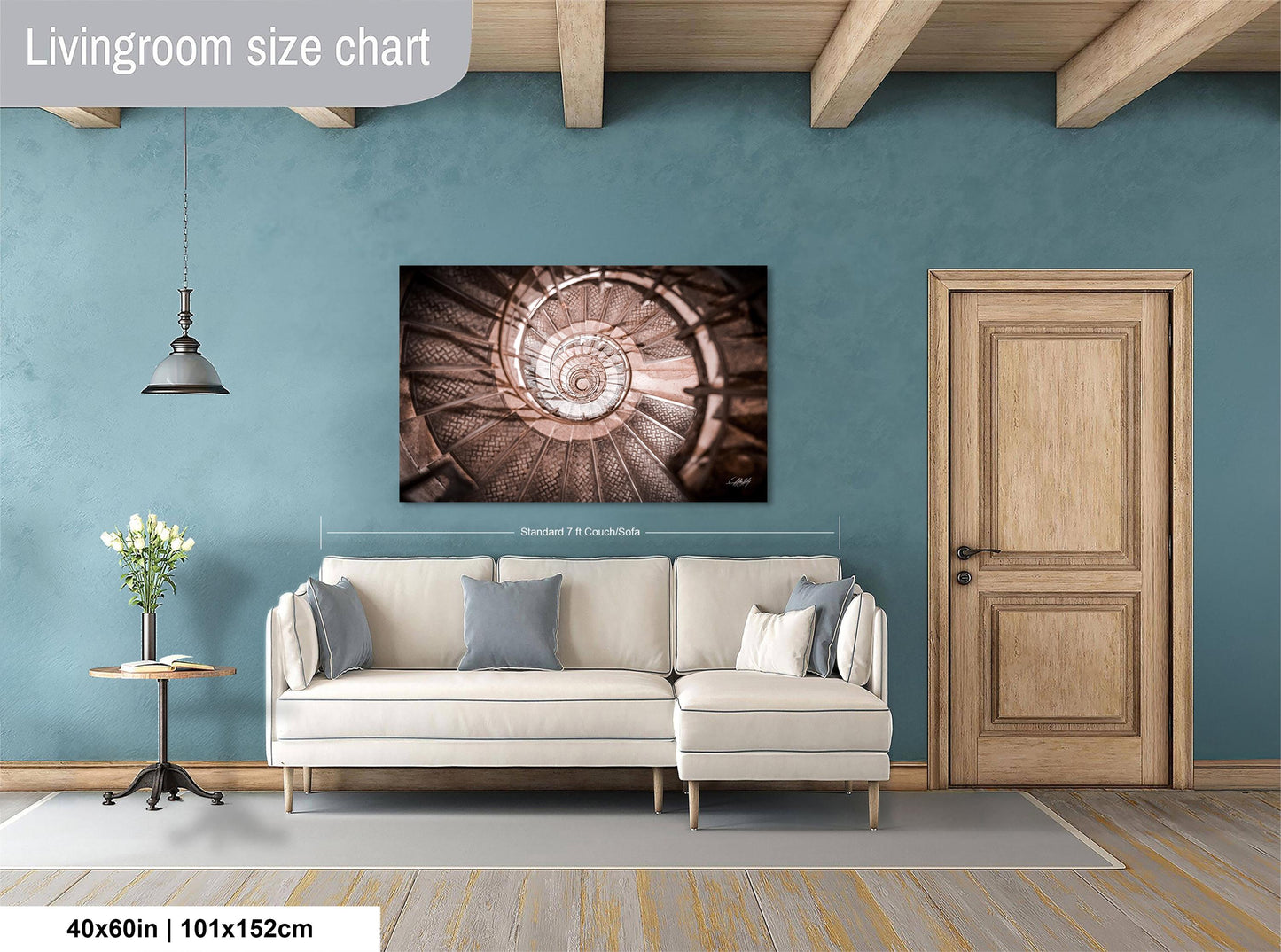 a living room with a white sofa, a wooden door, and a spiral staircase on the wall.