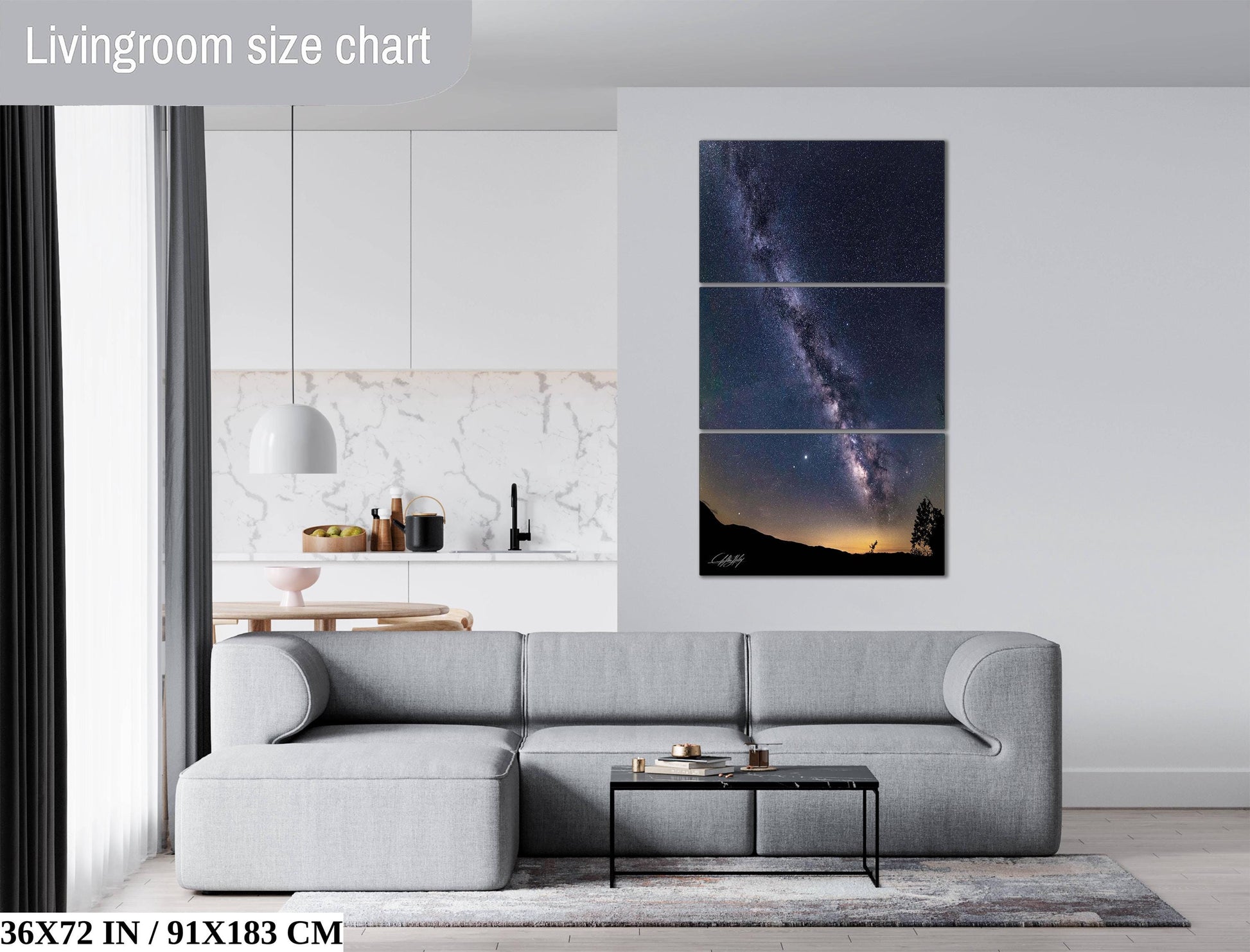 The image is a living room with a gray sofa, a coffee table, and a large wall art depicting a night sky with a galaxy.