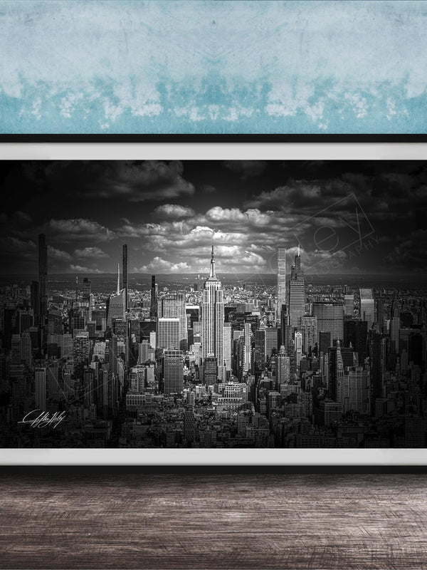 A black and white photograph of a cityscape, likely New York, with numerous tall buildings and skyscrapers in the background.