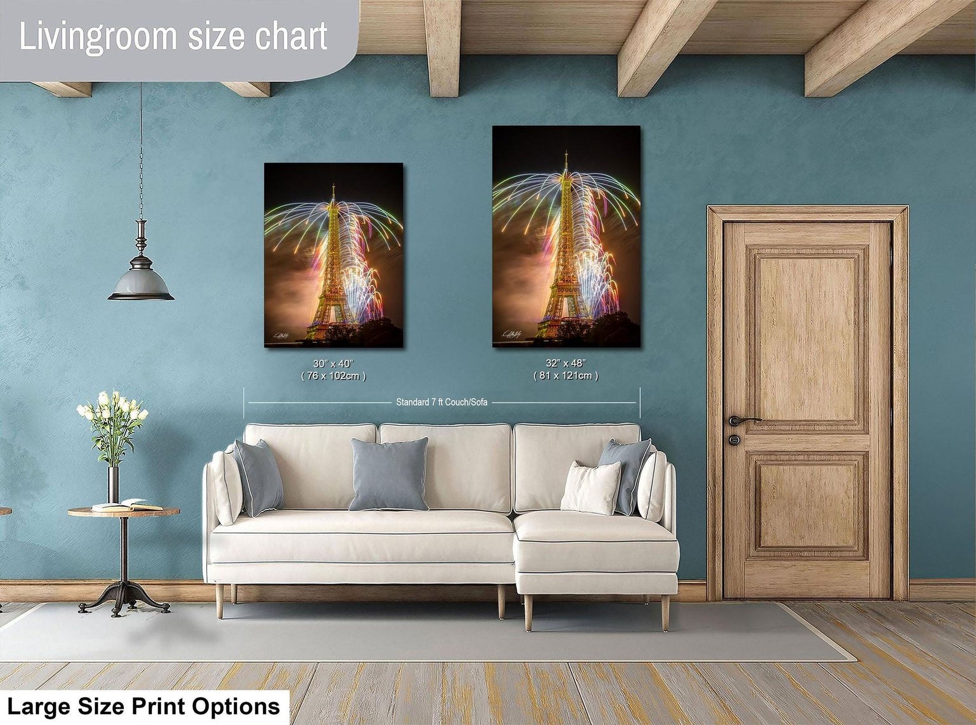 a living room with a white sofa, a wooden door, and a large size chart for artwork on the wall.