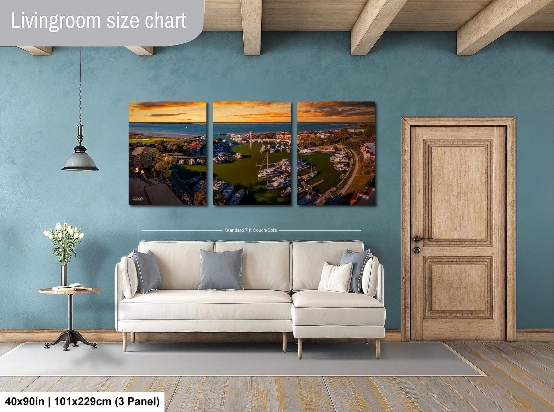 The image is a living room with a large, three-panel living room size chart hanging on the wall. The chart displays the dimensions of the living room in feet and inches, providing a visual representation of the room's size.