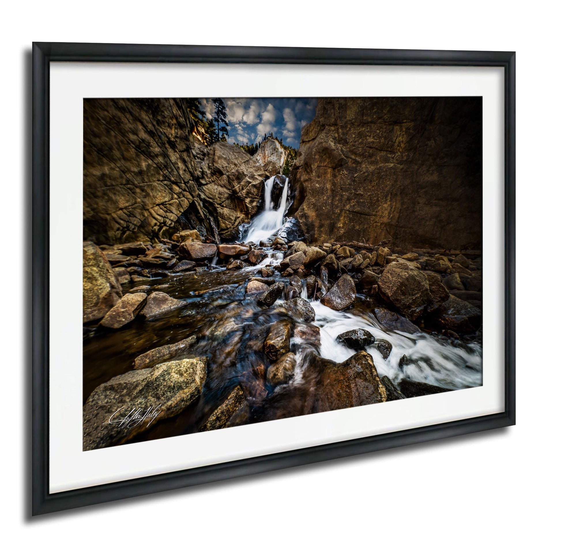 a serene waterfall cascading down a rocky cliff face, surrounded by a lush green forest.