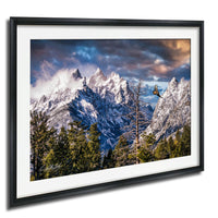 a breathtaking mountain landscape with snow-capped peaks, a lone tree, and a bird soaring in the sky.