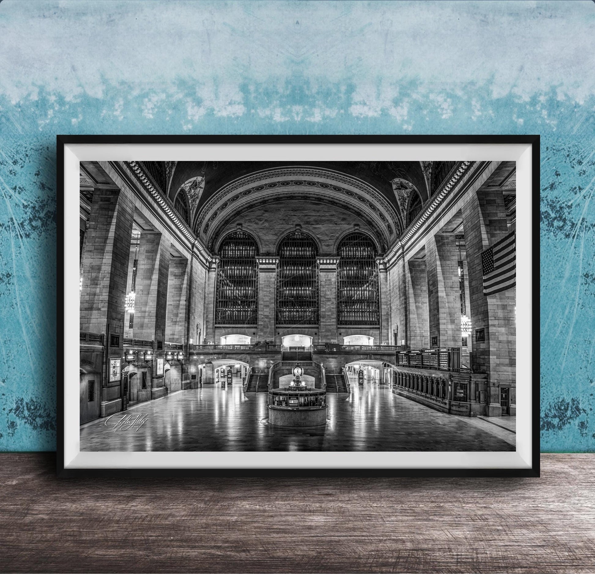 The image is a black and white photograph of a grand, ornate interior space with high ceilings, arched windows, and intricate architectural details.