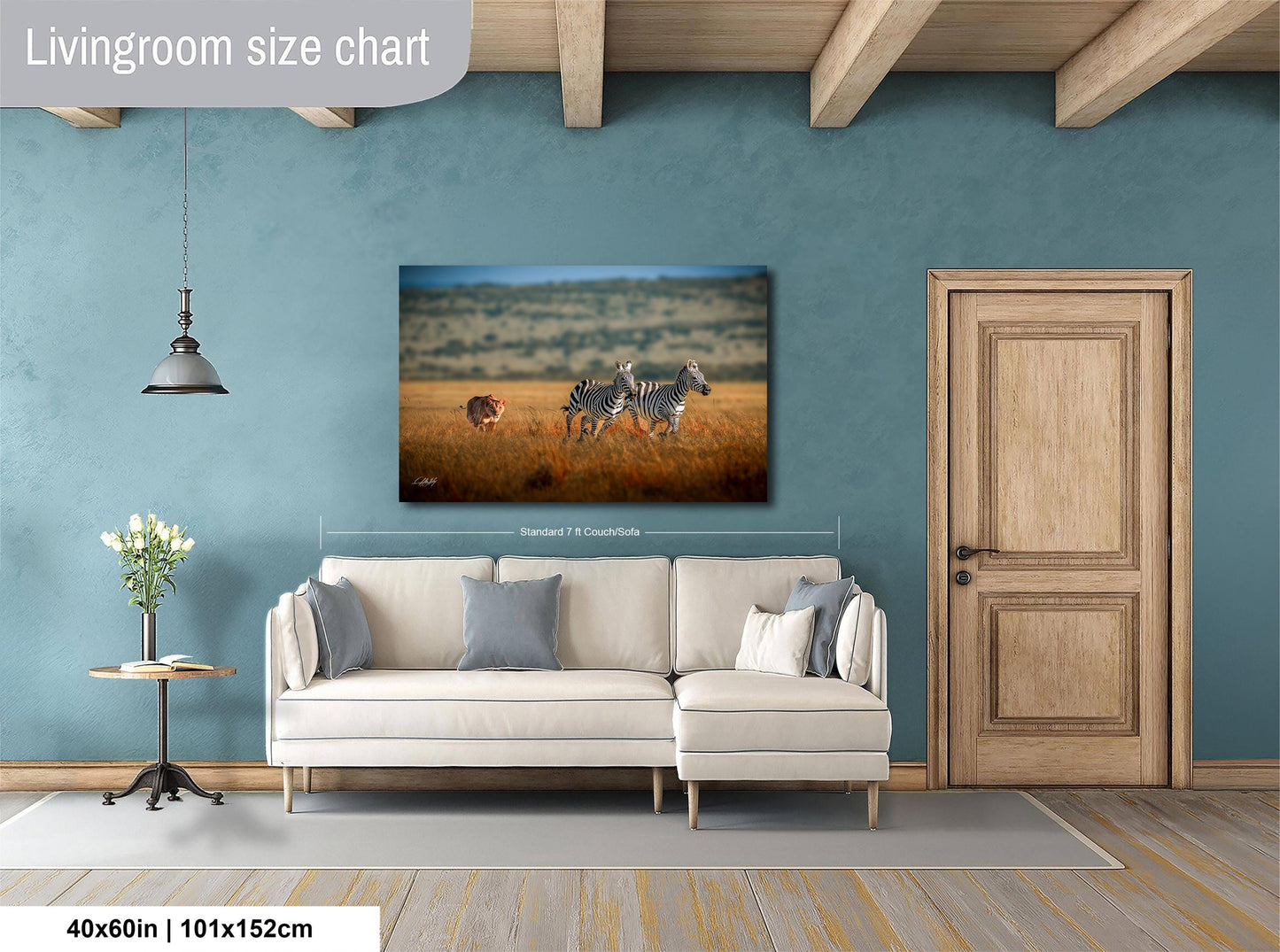 a living room with a large painting of a zebra and a lion in a grassy field hanging on the wall. The painting is approximately 40 inches wide and 115 centimeters tall.
