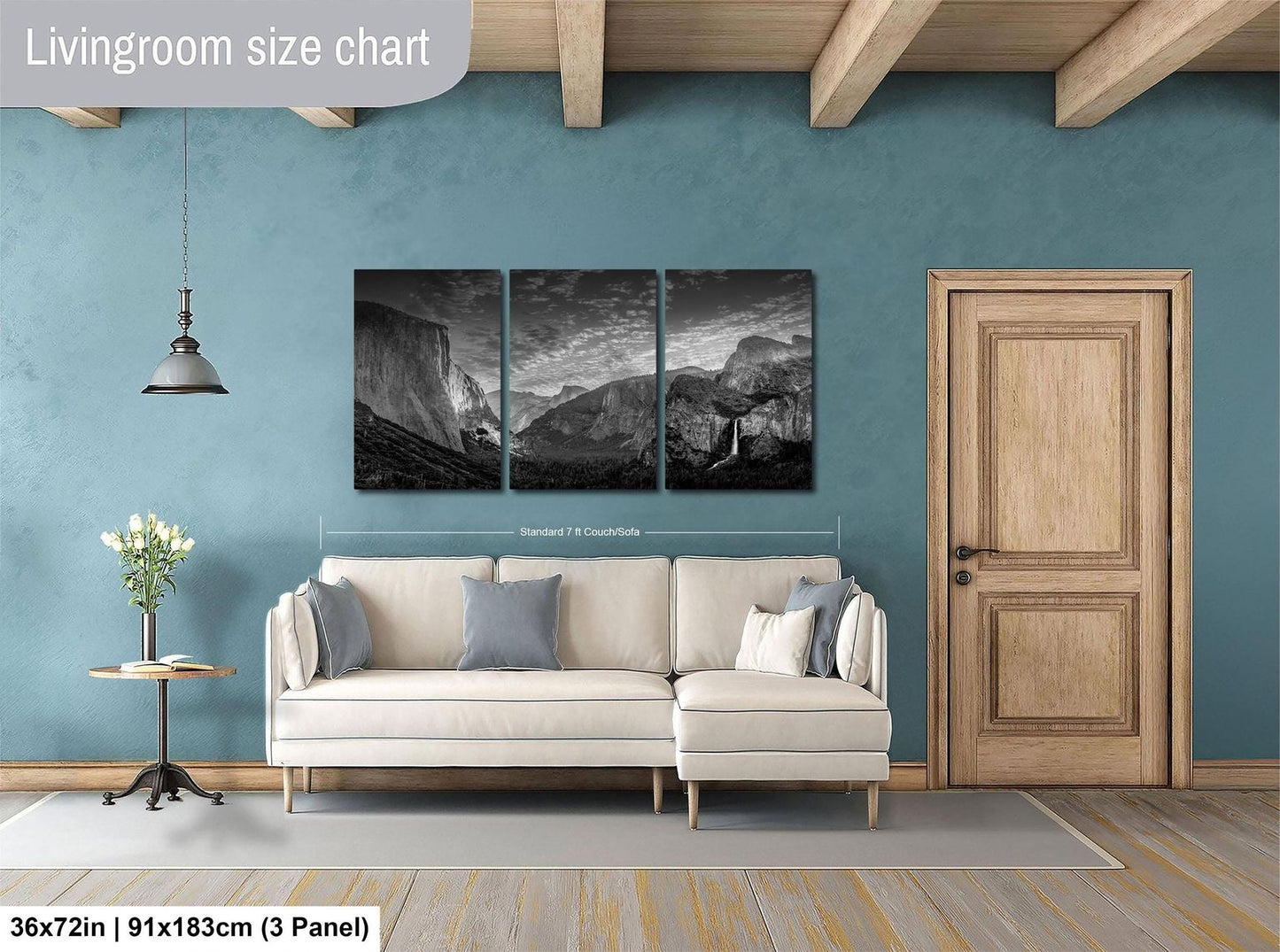 The image is a living room with a large wall art depicting a mountain landscape. The wall art is divided into three panels, with the largest panel being the central focus. The room features a white sofa, a wooden door, and a small table with a vase of flowers. The living room size chart indicates that the space is approximately 36 square meters.