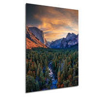 a breathtaking mountainous landscape with a winding river flowing through a dense forest. The sky is filled with vibrant colors, creating a stunning backdrop for the natural scenery.