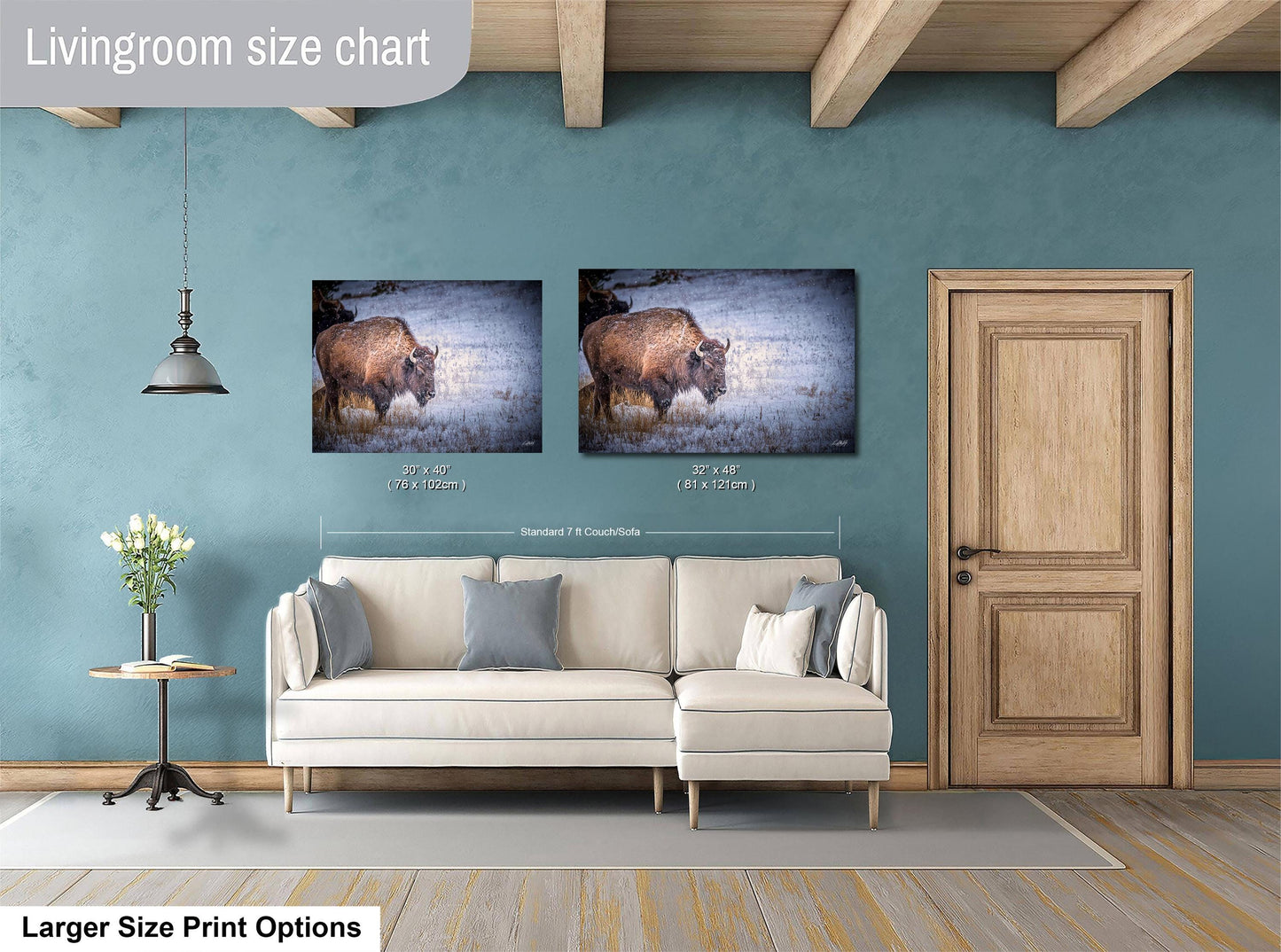 a living room with a couch and two pictures on the wall