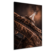 the Eiffel Tower, a famous landmark in Paris, France, with its intricate iron lattice structure illuminated against a dark sky.