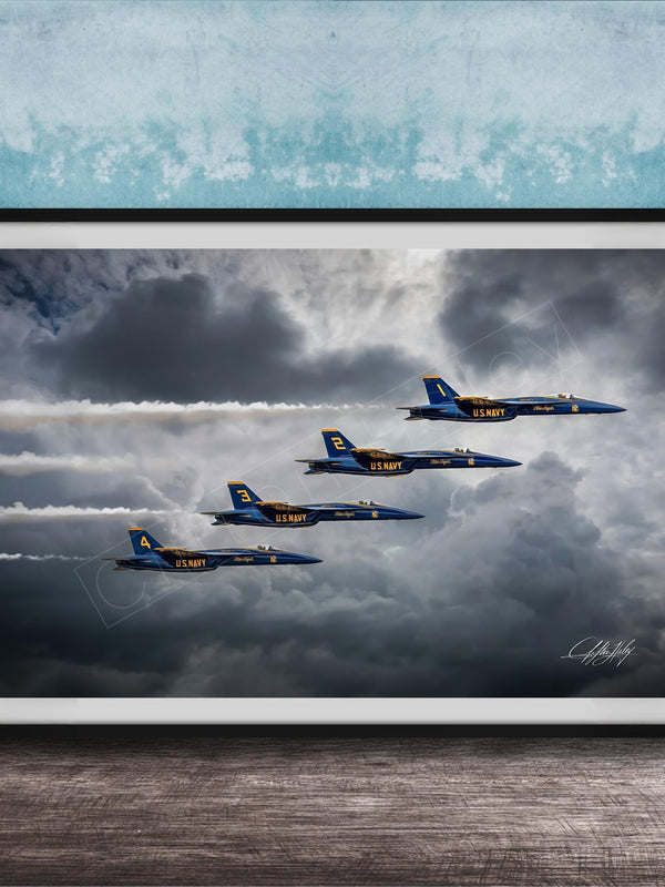 four blue and yellow fighter jets flying in formation against a cloudy sky.