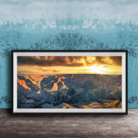 The image is a framed photograph of a breathtaking view of the Grand Canyon at sunset, with the sun setting behind the mountains and casting a warm, golden glow over the landscape.