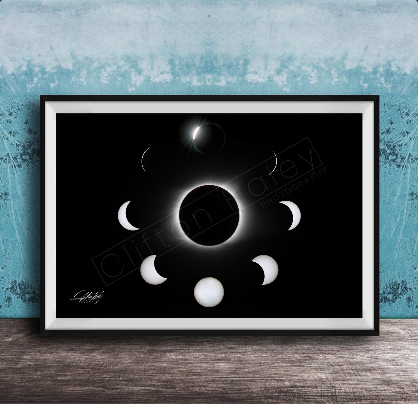 The image is a framed poster depicting the solar eclipse, showing the moon's phases around the sun.