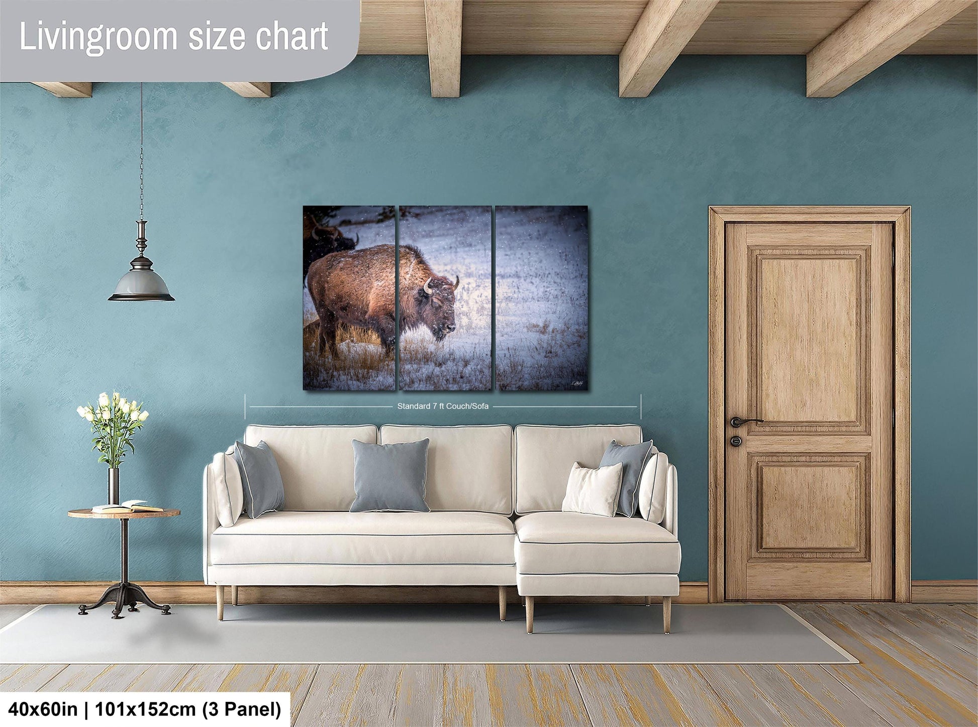 a living room with a couch and a painting on the wall