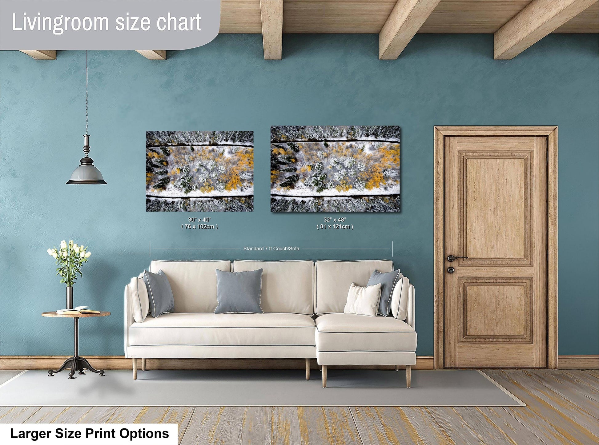 a living room with a white sofa, a wooden door, and two framed pictures hanging on the wall.