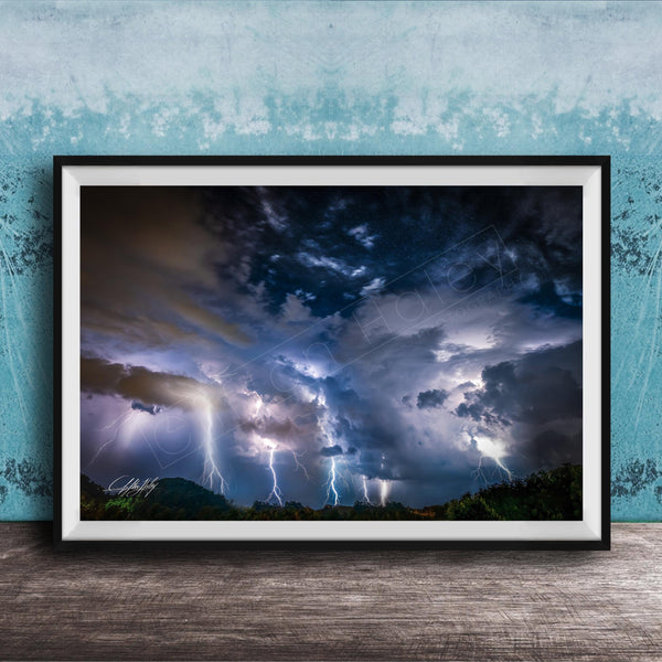 a dramatic and awe-inspiring thunderstorm, with lightning bolts streaking across the sky and dark, ominous clouds looming overhead.