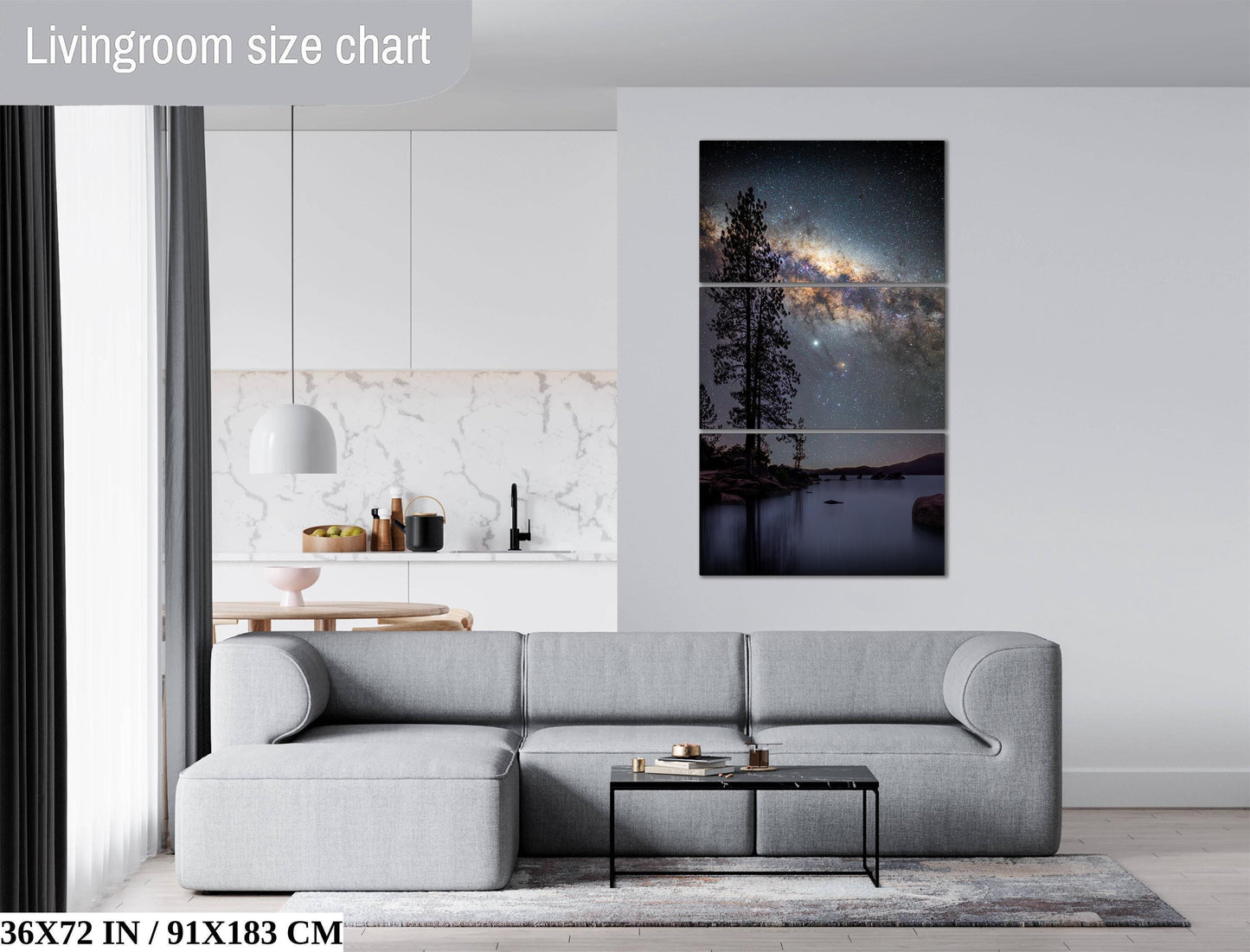 a modern living room with a gray sectional sofa, a coffee table, and a large wall art piece depicting a night sky with a galaxy.