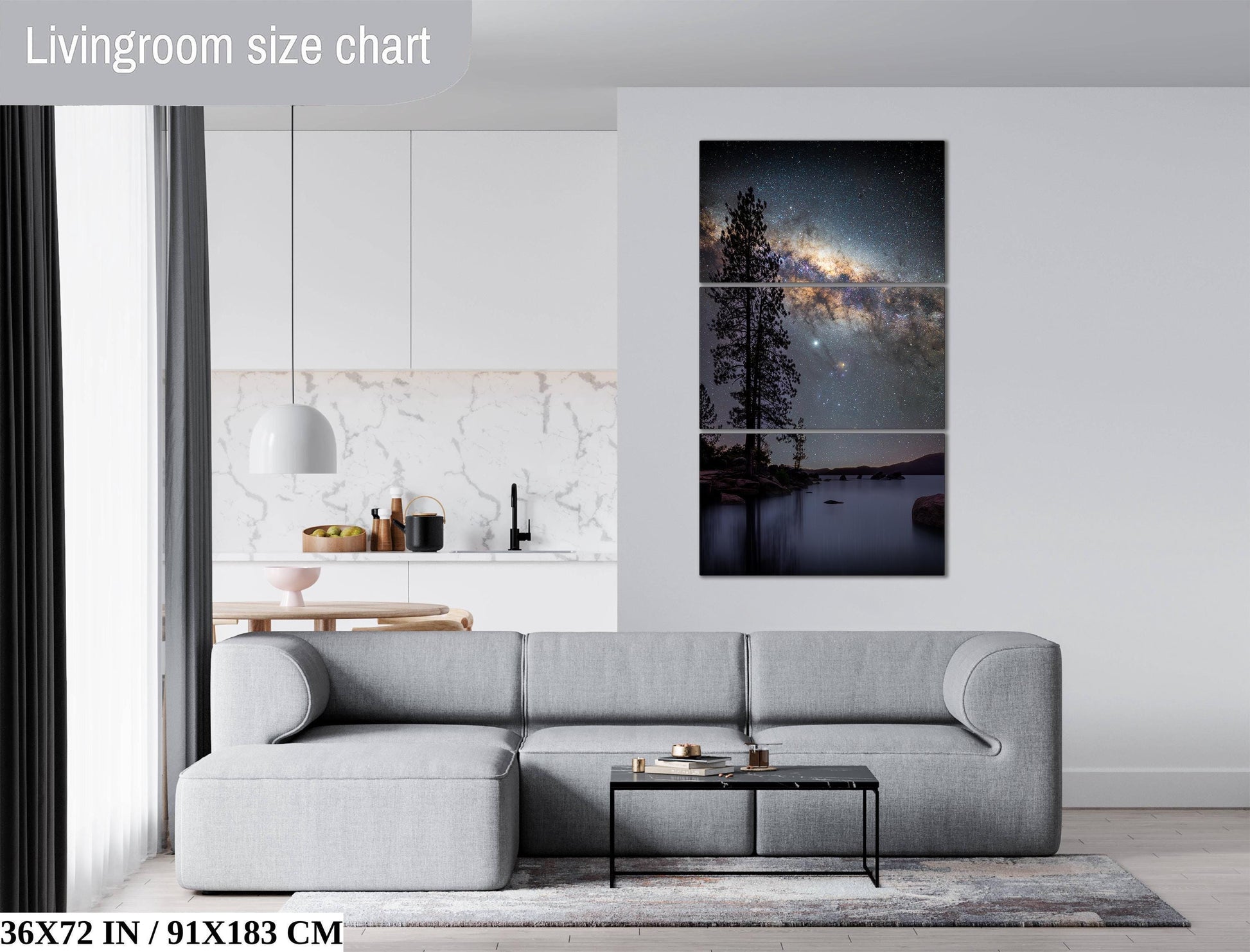 a modern living room with a gray sectional sofa, a coffee table, and a large wall art piece depicting a night sky with a galaxy.