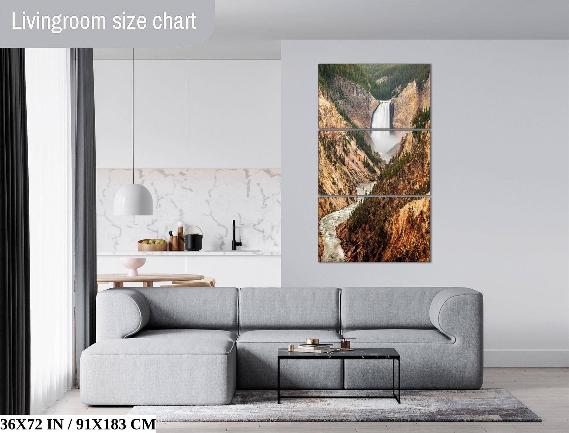 The image is a living room with a gray sofa, a coffee table, and a large painting of a waterfall hanging on the wall.