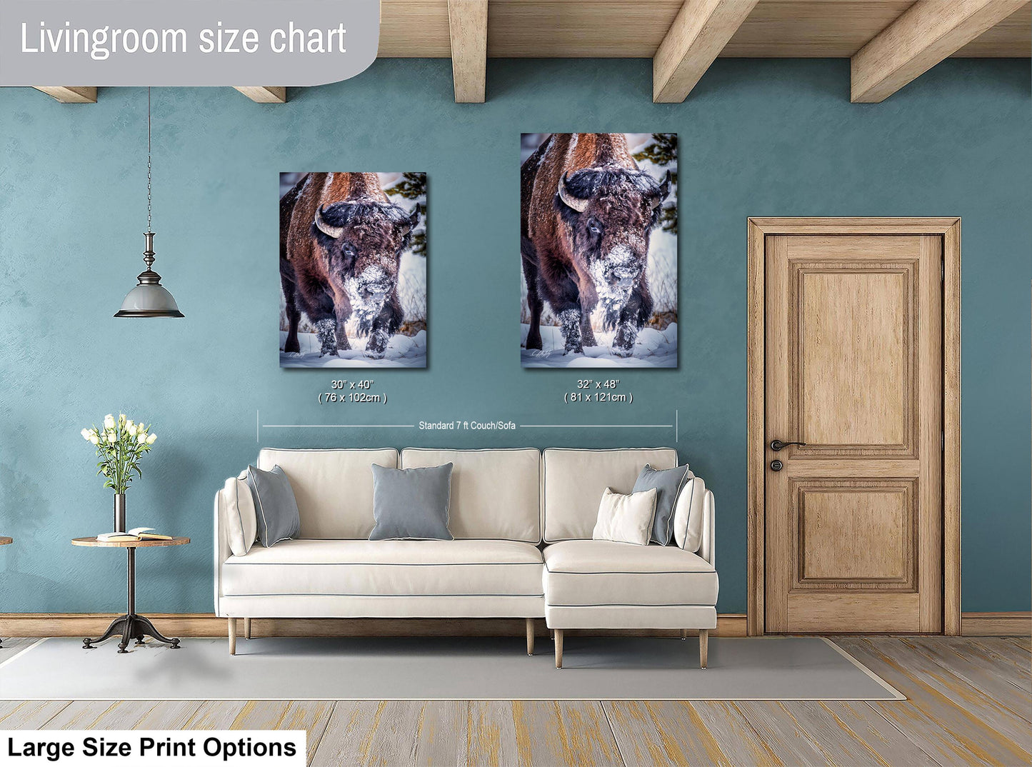 a living room with a couch and two pictures on the wall
