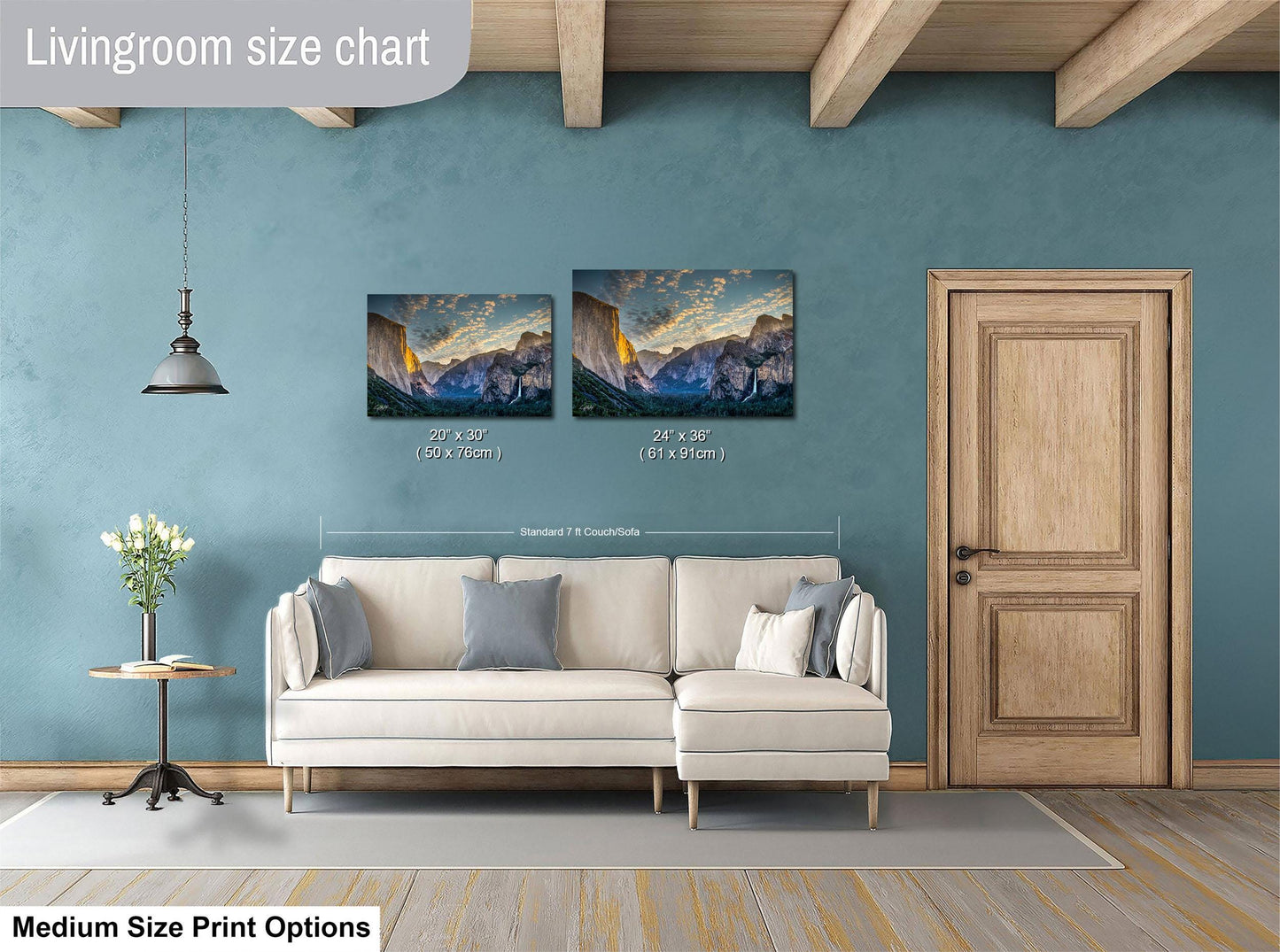a living room with a white sofa, a wooden door, and a painting of a mountain landscape on the wall. The living room appears to be designed for relaxation and comfort, with a focus on the artwork and the overall aesthetic.