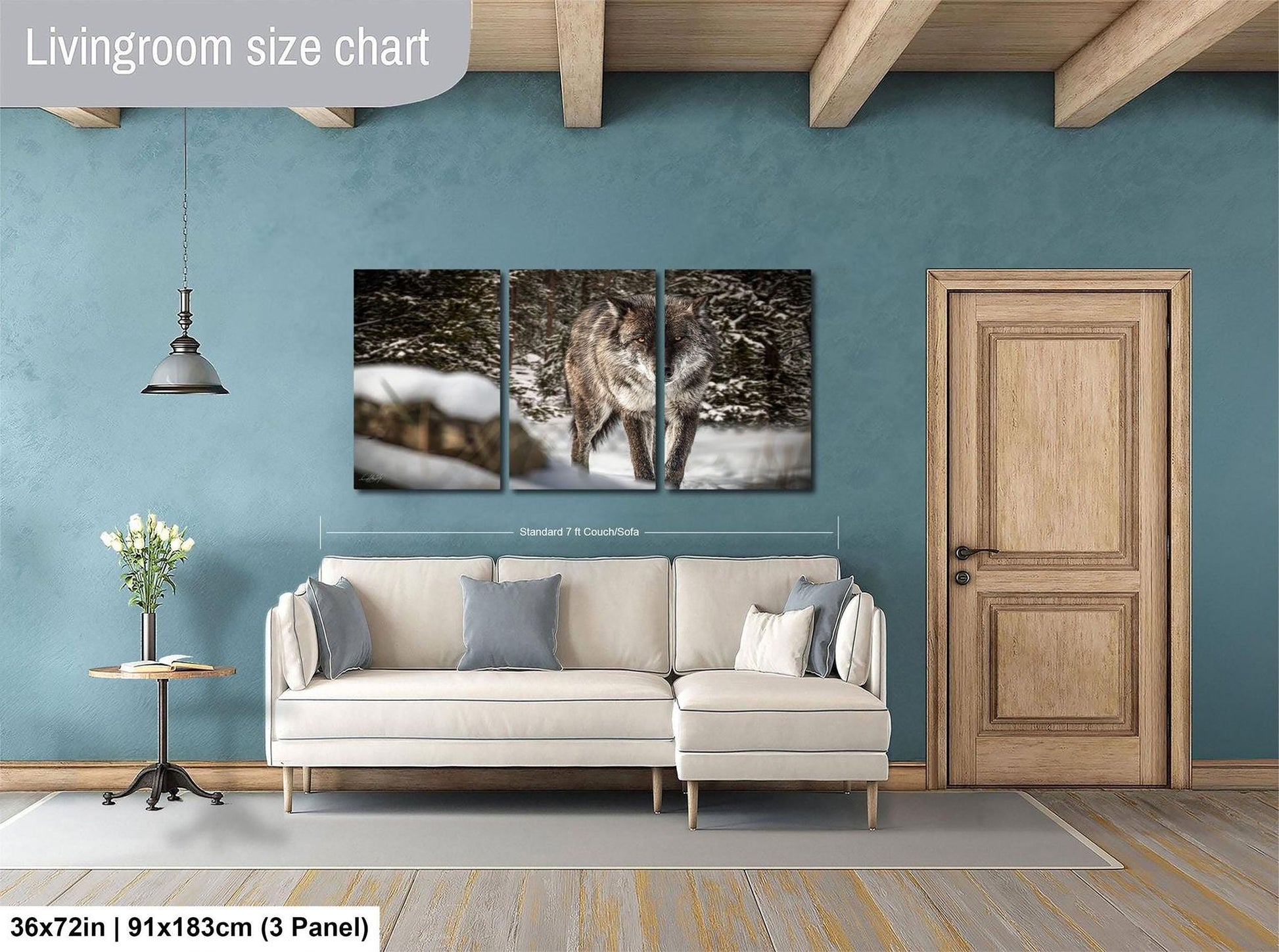 The image is a living room with a large white sofa, a wooden door, and a painting of a wolf on the wall.