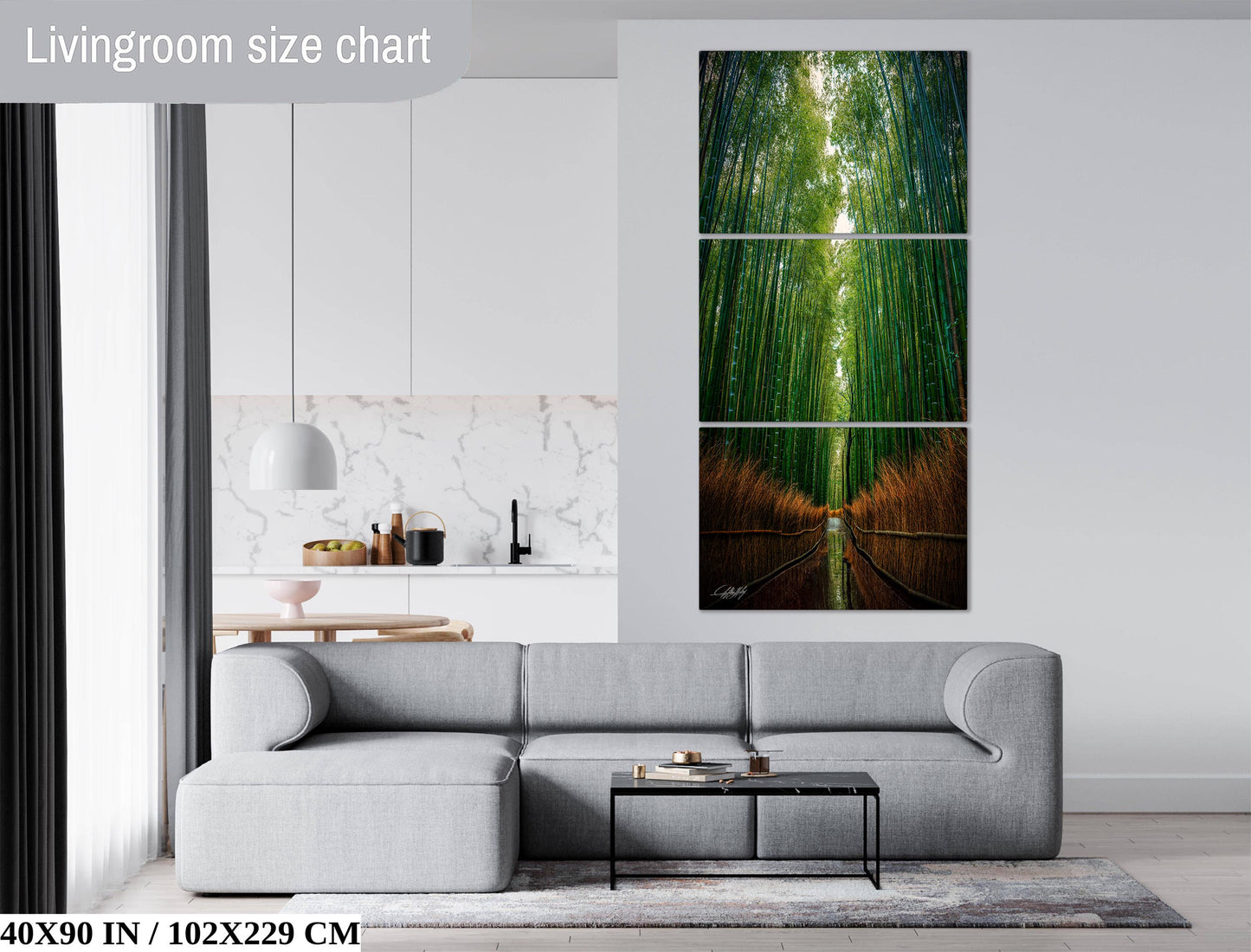 The image is a living room with a gray sofa, a coffee table, and a large painting of a forest scene on the wall.