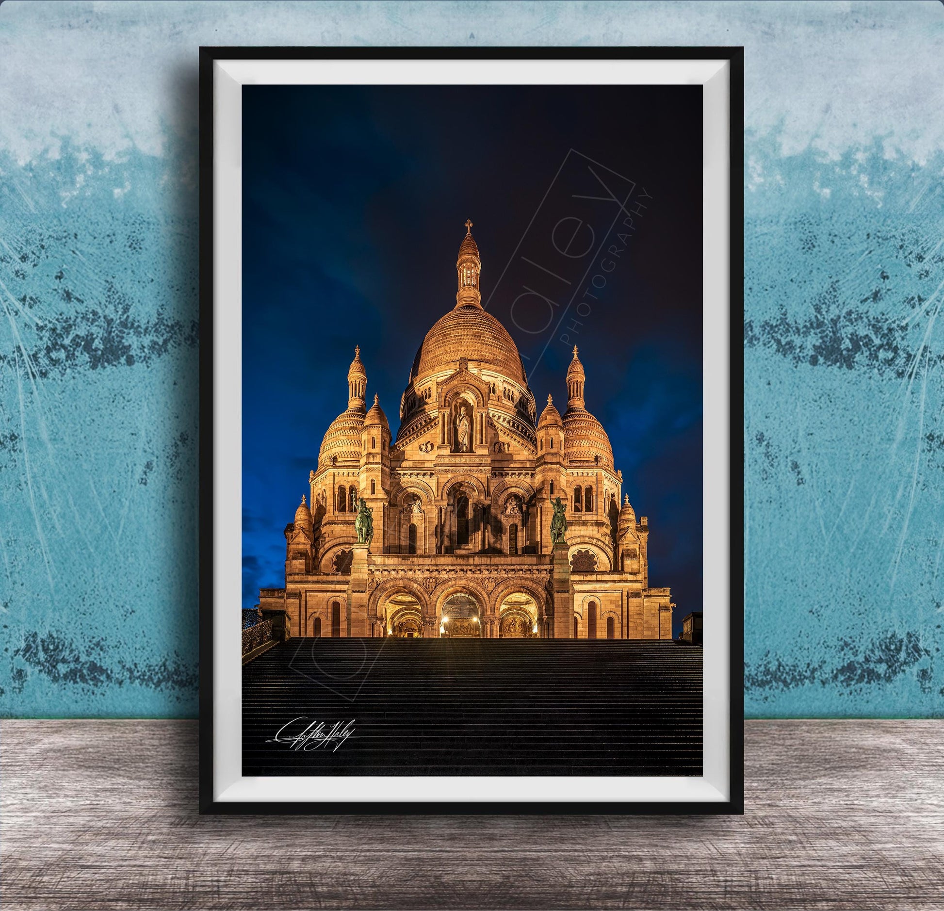 a large, ornate cathedral with multiple domes and towers, illuminated at night against a dark sky.