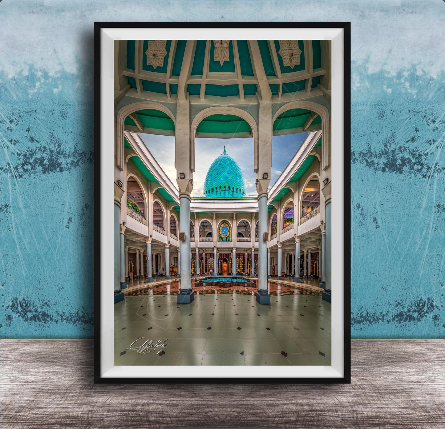 a grand, ornate building with a domed roof and arched windows, set against a blue wall.