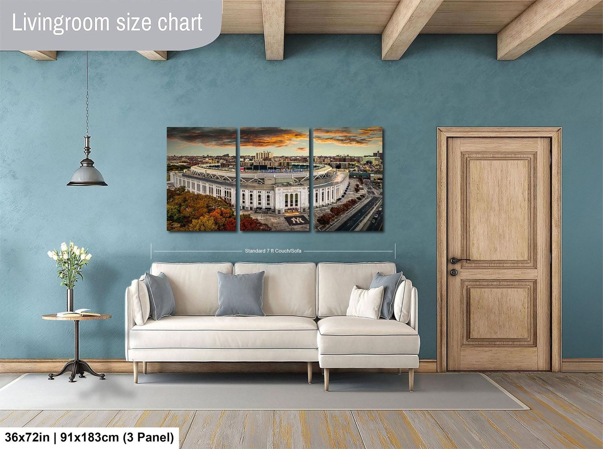 The image is a living room with a large, three-panel living room size chart on the wall. The chart displays the dimensions of the living room in both square feet and square meters. The living room is furnished with a white sofa and a wooden door, and there is a vase of flowers on a table nearby.