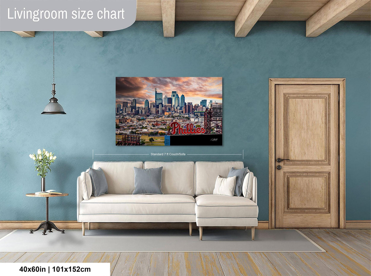 a living room with a large city skyline painting hanging on the wall above a white sofa.