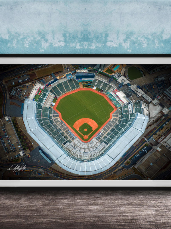 An aerial view of a baseball stadium, with the field, seating areas, and surrounding infrastructure clearly visible.