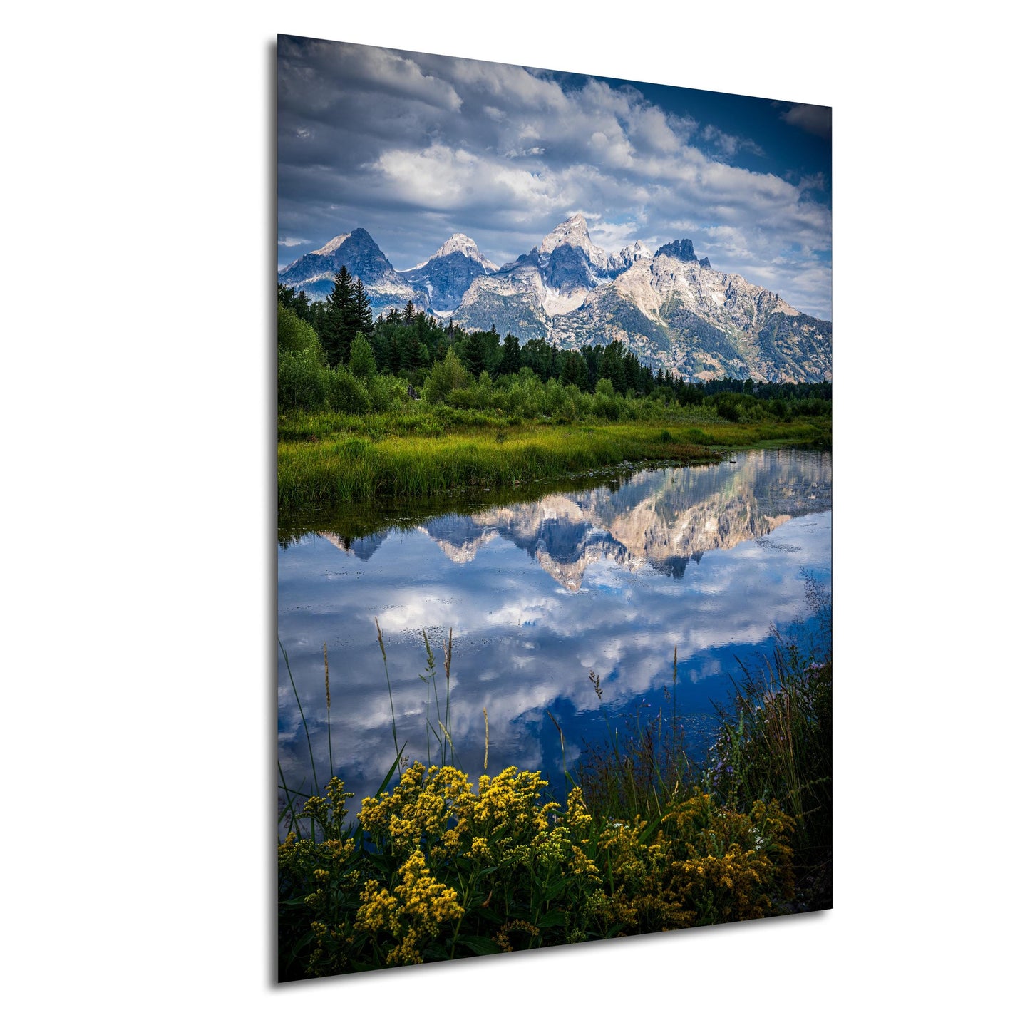 a serene landscape with a calm lake reflecting the majestic snow-capped mountains in the background. The mountains are surrounded by lush green forests, creating a picturesque scene. The sky above is a clear blue, dotted with fluffy white clouds. The image is a collage of multiple images, showcasing the beauty of nature and the tranquility of the scene.