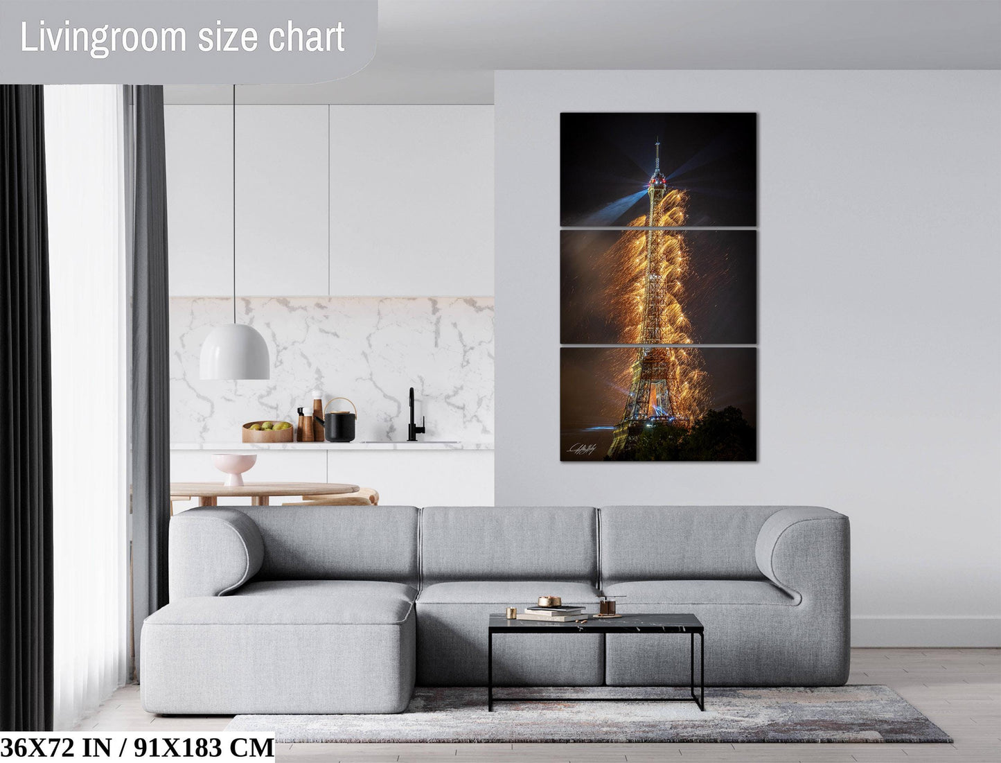 The image is a living room with a gray sofa, a coffee table, and a large wall art depicting the Eiffel Tower with a fireworks display.