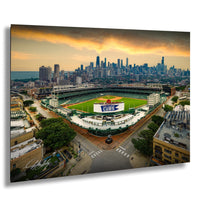 An aerial view of a baseball stadium in Chicago, Illinois, with the city skyline in the background.